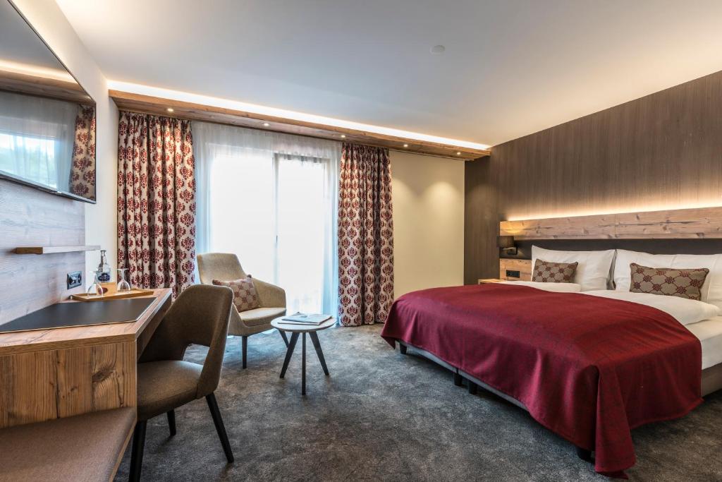 Ein Bett oder Betten in einem Zimmer der Unterkunft Hotel Gibswilerstube