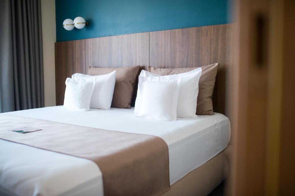 Postel nebo postele na pokoji v ubytování Hotel Oxford