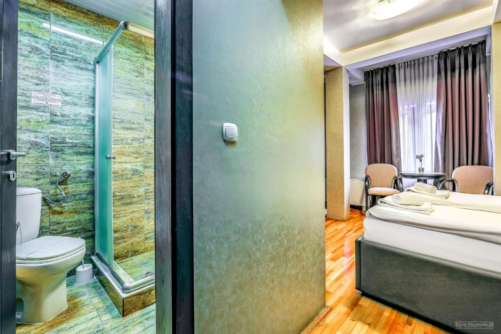 Koupelna v ubytování Tino Hotel & SPA
