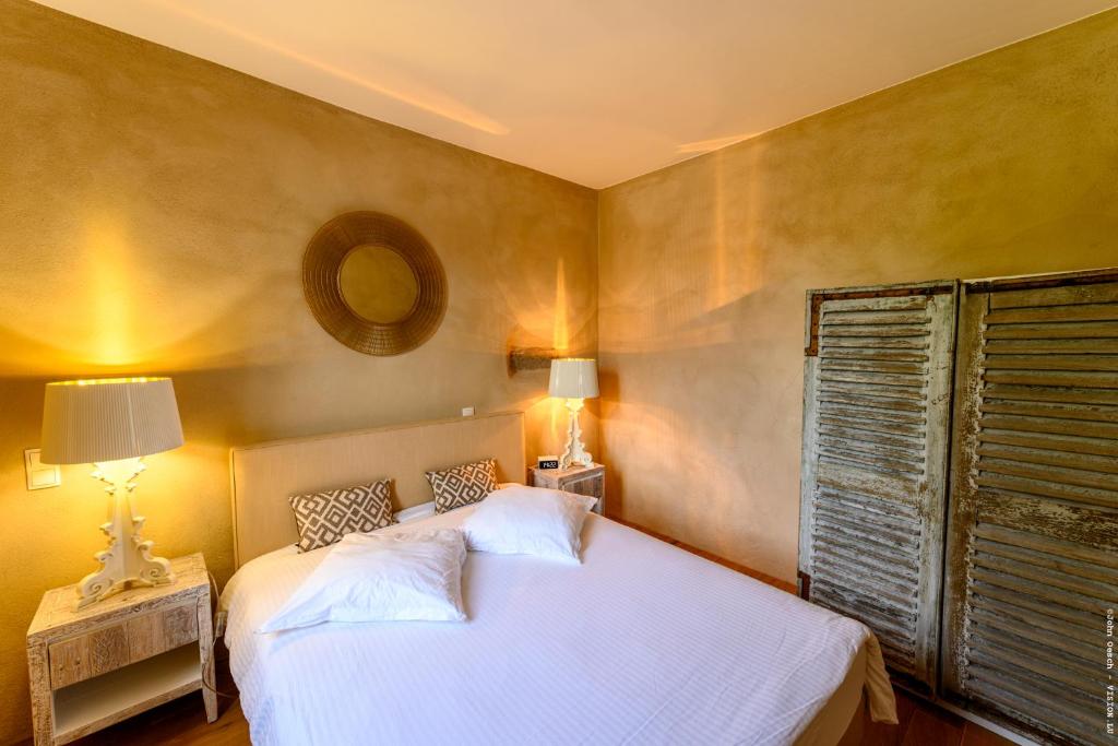 Postel nebo postele na pokoji v ubytování Restauberge Peitry