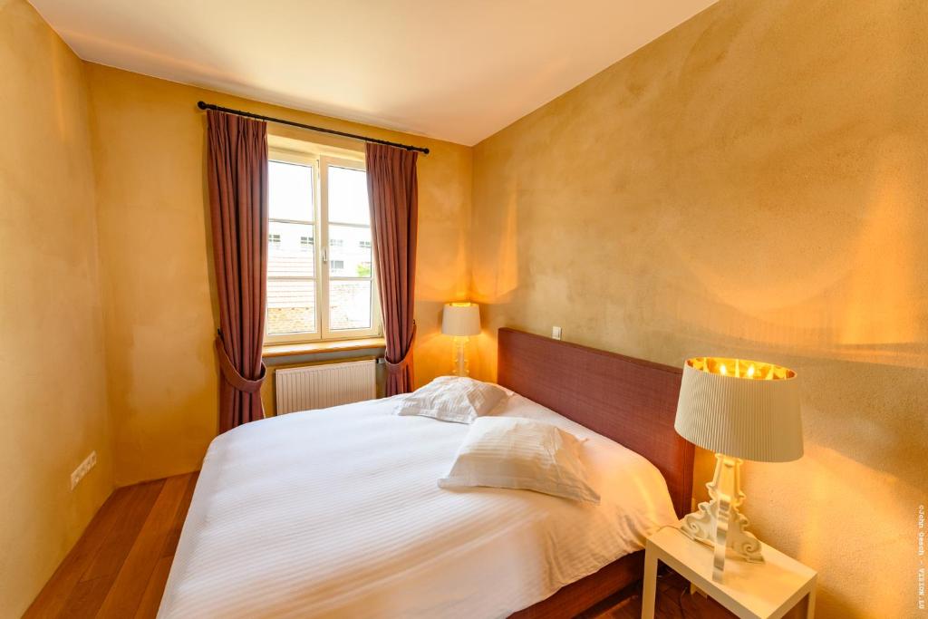Postel nebo postele na pokoji v ubytování Restauberge Peitry
