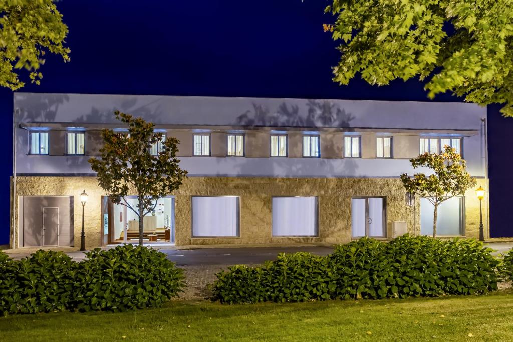 an external view of a building at night at Boutique Mouras in Mondim de Basto