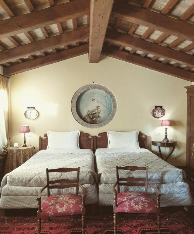 Łóżko lub łóżka w pokoju w obiekcie B&B Casa Camilla