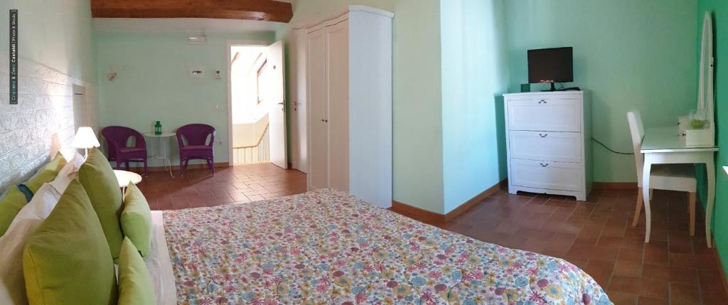 Postel nebo postele na pokoji v ubytování B&B Dimora Paolina