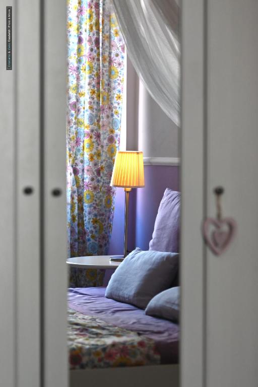 Postel nebo postele na pokoji v ubytování B&B Dimora Paolina