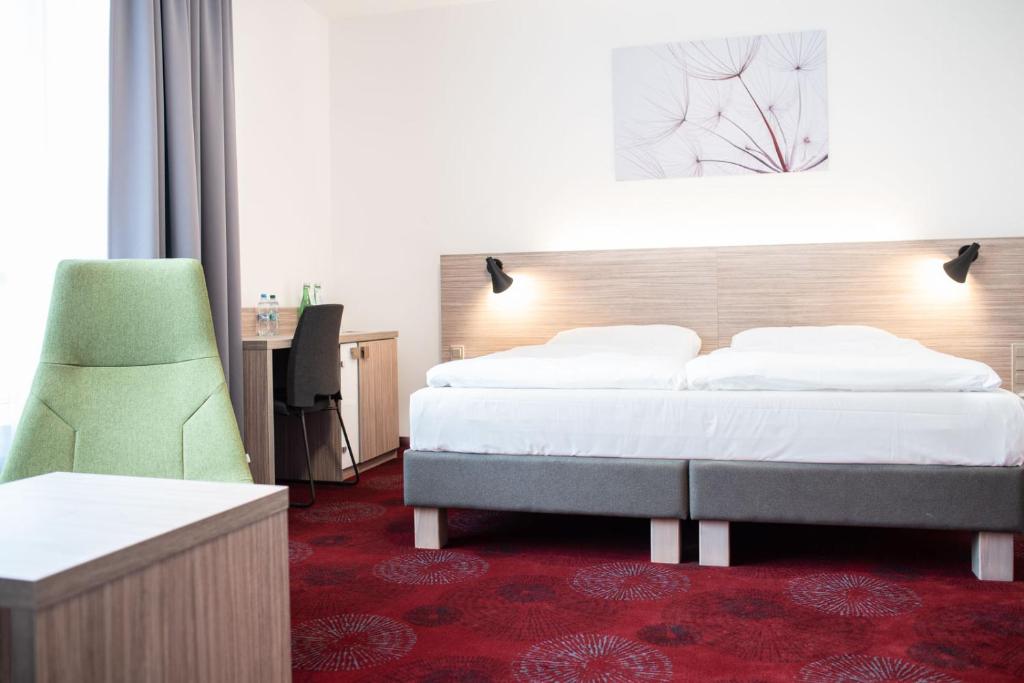 Postel nebo postele na pokoji v ubytování Hotel TAMMEL