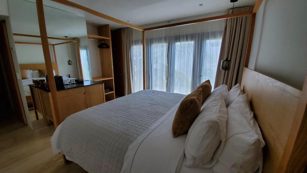 Postel nebo postele na pokoji v ubytování Hotel Secreto