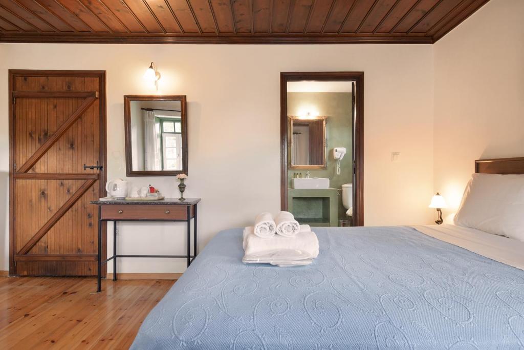 Postel nebo postele na pokoji v ubytování Ameliko Zagori