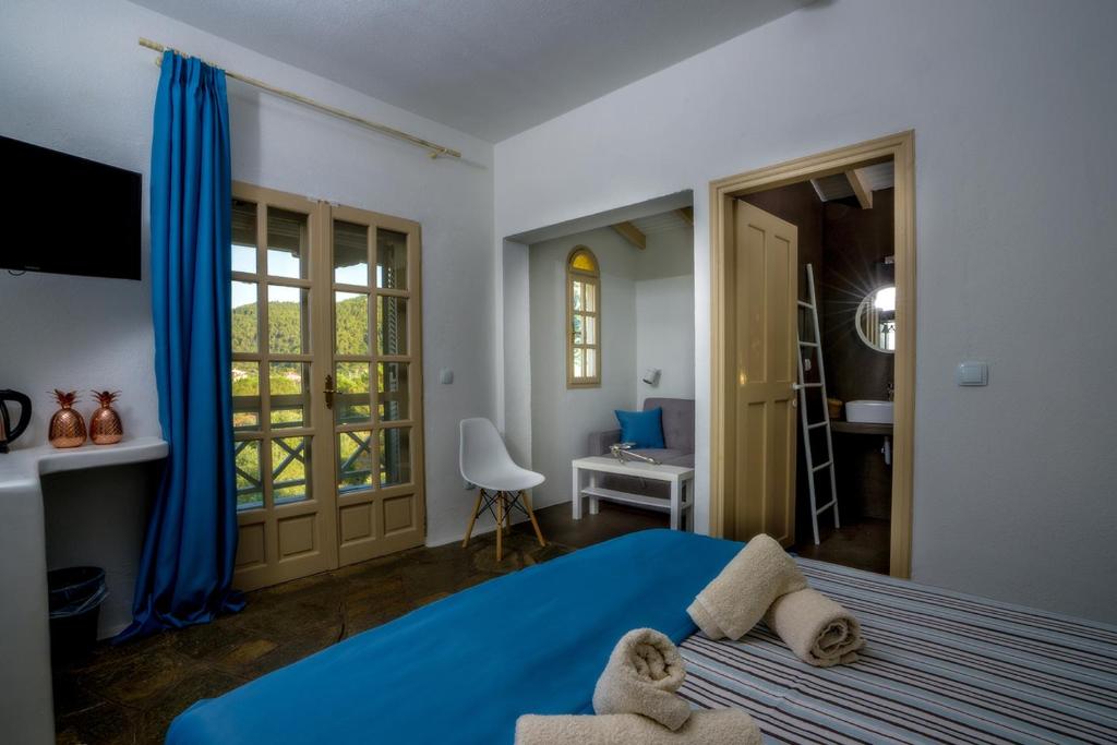 Postel nebo postele na pokoji v ubytování PETRA MARE SUITES