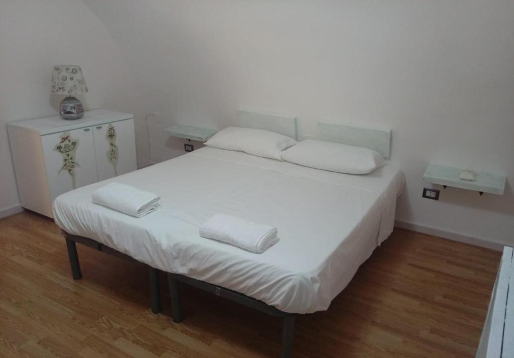 Voodi või voodid majutusasutuse Residenza l'Orologio toas