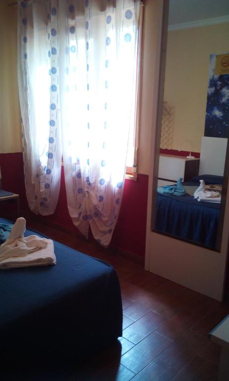 Posteľ alebo postele v izbe v ubytovaní Villa Morgante B&B