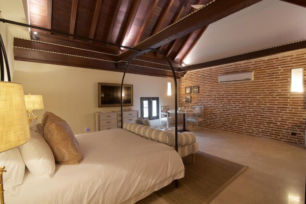 Postel nebo postele na pokoji v ubytování Hotel Capellán de Getsemaní