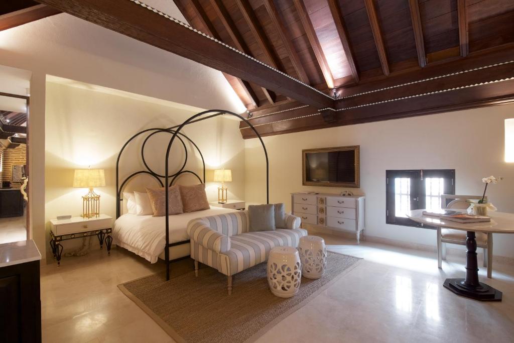 Postel nebo postele na pokoji v ubytování Hotel Capellán de Getsemaní