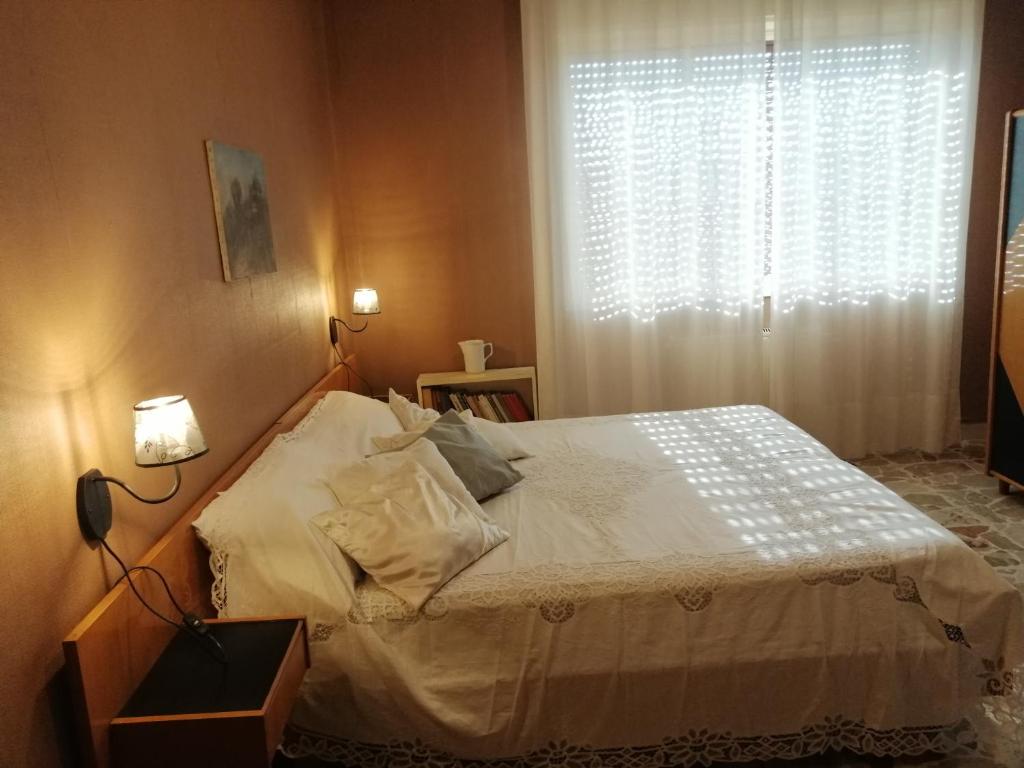 Posteľ alebo postele v izbe v ubytovaní Appartamento d'Artista