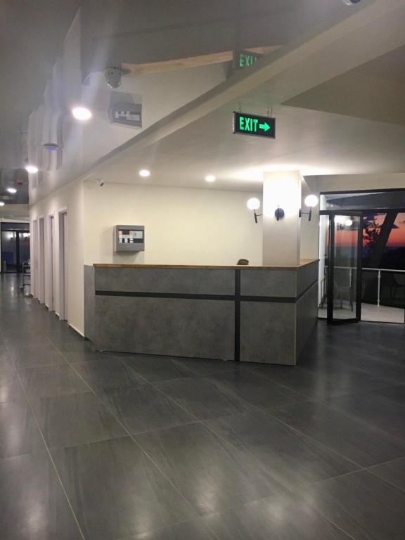 an empty lobby with a reception desk in a building at Hotel Scala in Shekhvetili