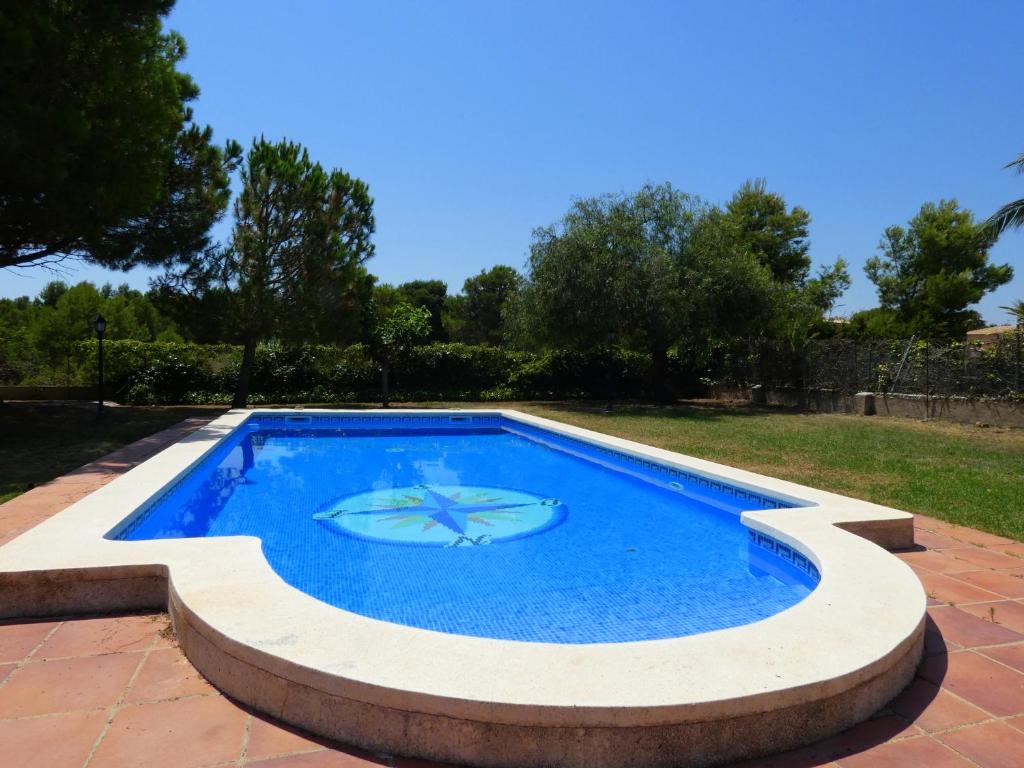 a large swimming pool in a yard at Rentalmar Chalet Dalias in Montroig