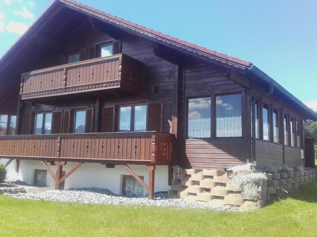 a large wooden house with a large deck at Haus Melanie in Hohenau