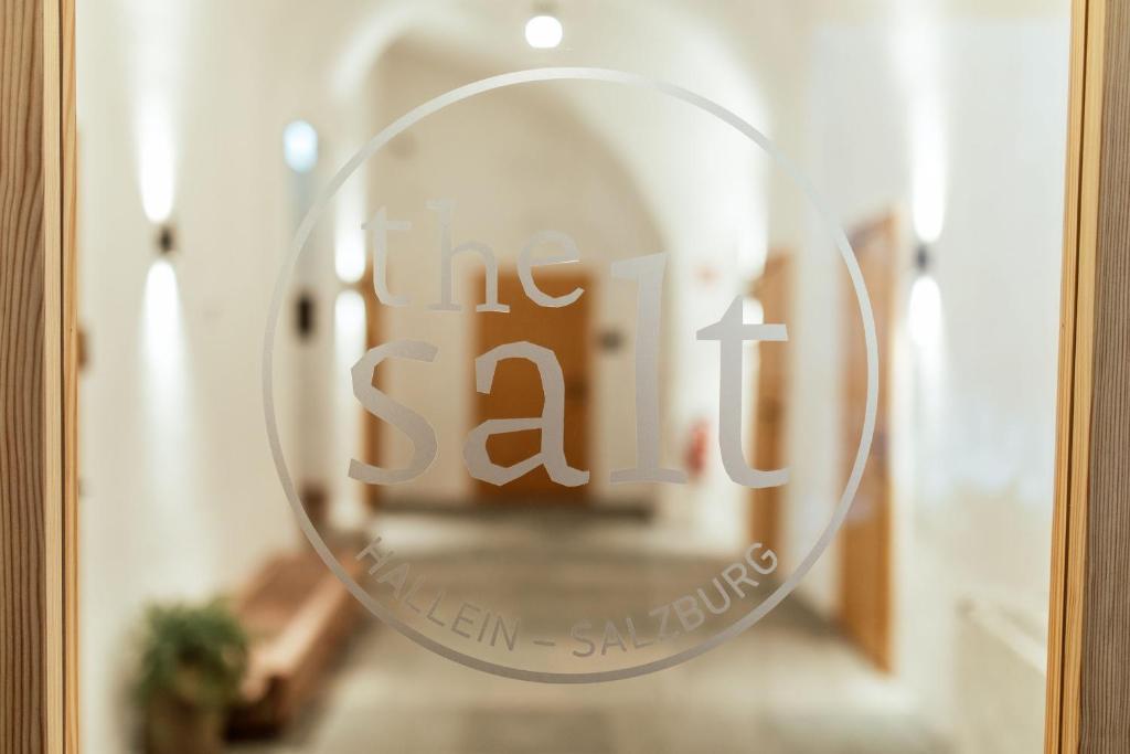 a glass door with the sale sign on it at the salt residences in Hallein