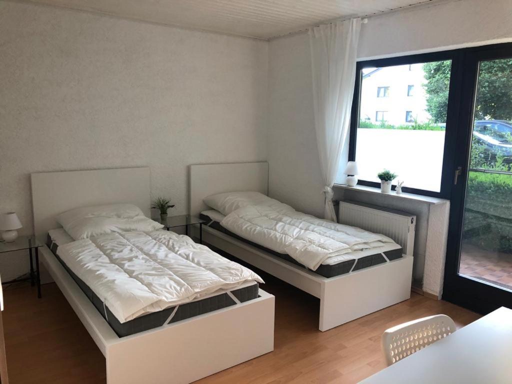 Postel nebo postele na pokoji v ubytování Pension Platzhirsch