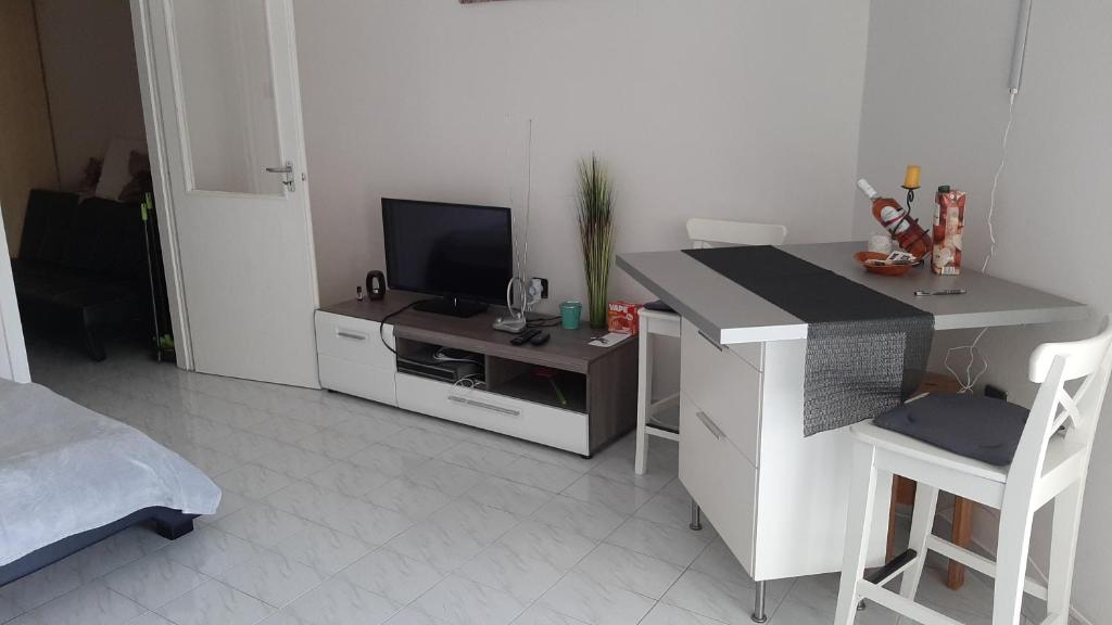 Televízia a/alebo spoločenská miestnosť v ubytovaní Onix -Orfű Aqua Apartman