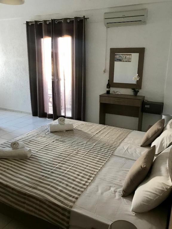 Postel nebo postele na pokoji v ubytování Lena Apartments