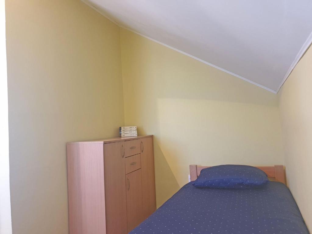 Postel nebo postele na pokoji v ubytování Kuća Ema