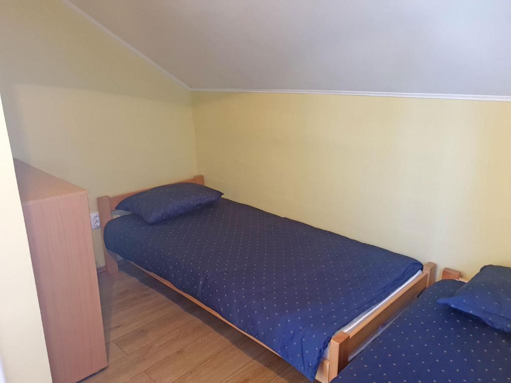 Postel nebo postele na pokoji v ubytování Kuća Ema