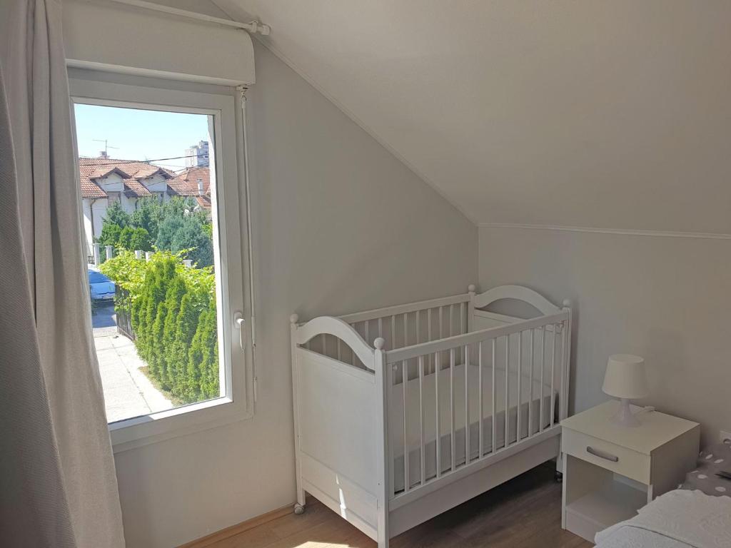 Postel nebo postele na pokoji v ubytování Kuća Ema