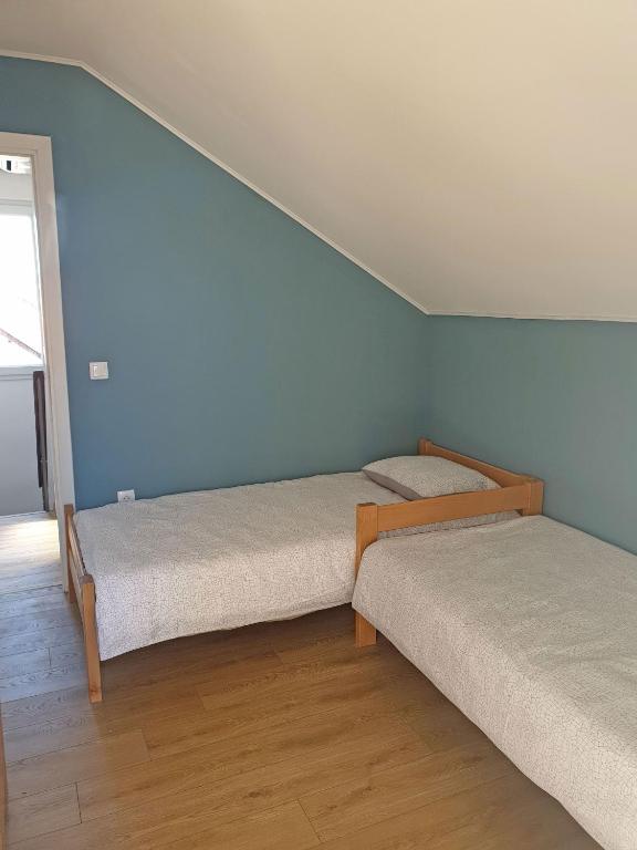Postel nebo postele na pokoji v ubytování Kuća Ema
