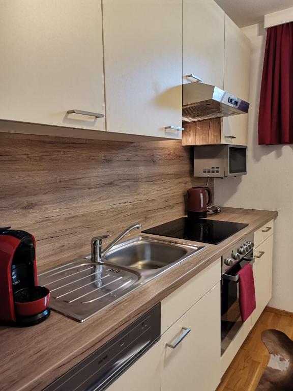 Kuchyň nebo kuchyňský kout v ubytování BERGHEIL Apartments