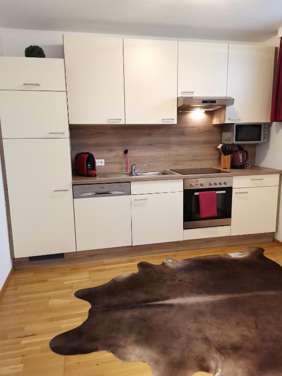 Kuchyň nebo kuchyňský kout v ubytování BERGHEIL Apartments