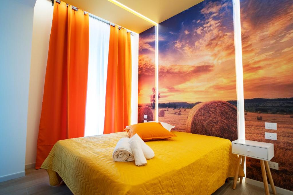 Łóżko lub łóżka w pokoju w obiekcie L' Angolo dei poeti - Bed and Breakfast
