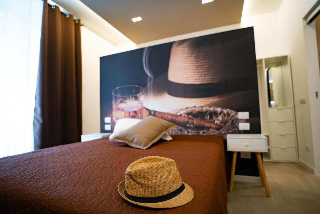 Łóżko lub łóżka w pokoju w obiekcie L' Angolo dei poeti - Bed and Breakfast