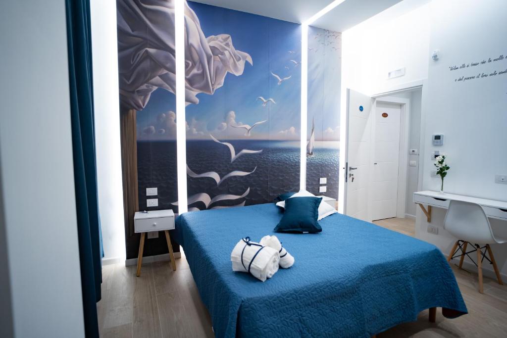 Łóżko lub łóżka w pokoju w obiekcie L' Angolo dei poeti - Bed and Breakfast
