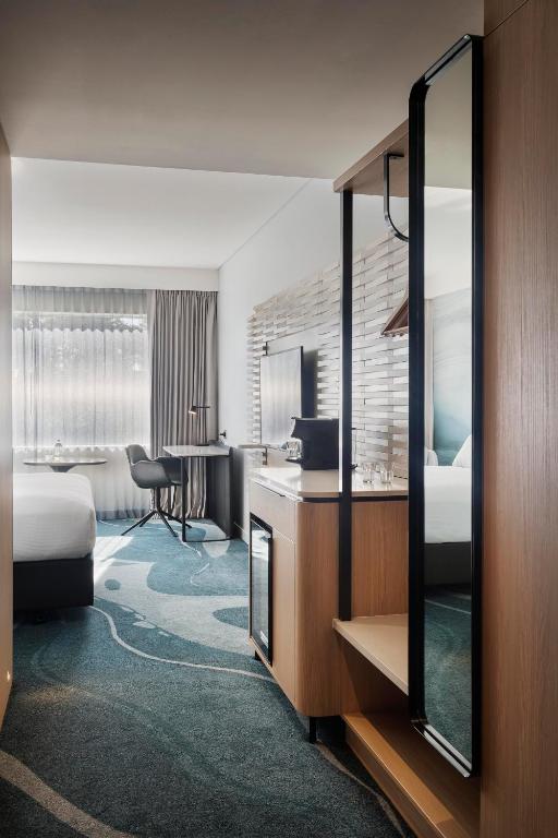 Postel nebo postele na pokoji v ubytování Novotel Tainui Hamilton