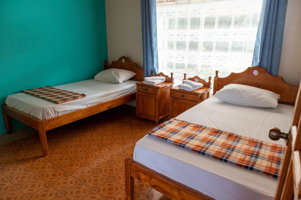 Postel nebo postele na pokoji v ubytování Hostel Bouganvilia Bed and Breakfast