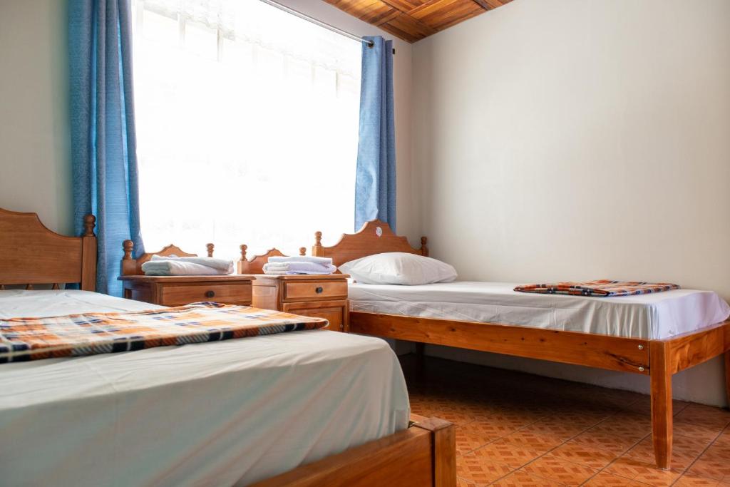 Postel nebo postele na pokoji v ubytování Hostel Bouganvilia Bed and Breakfast