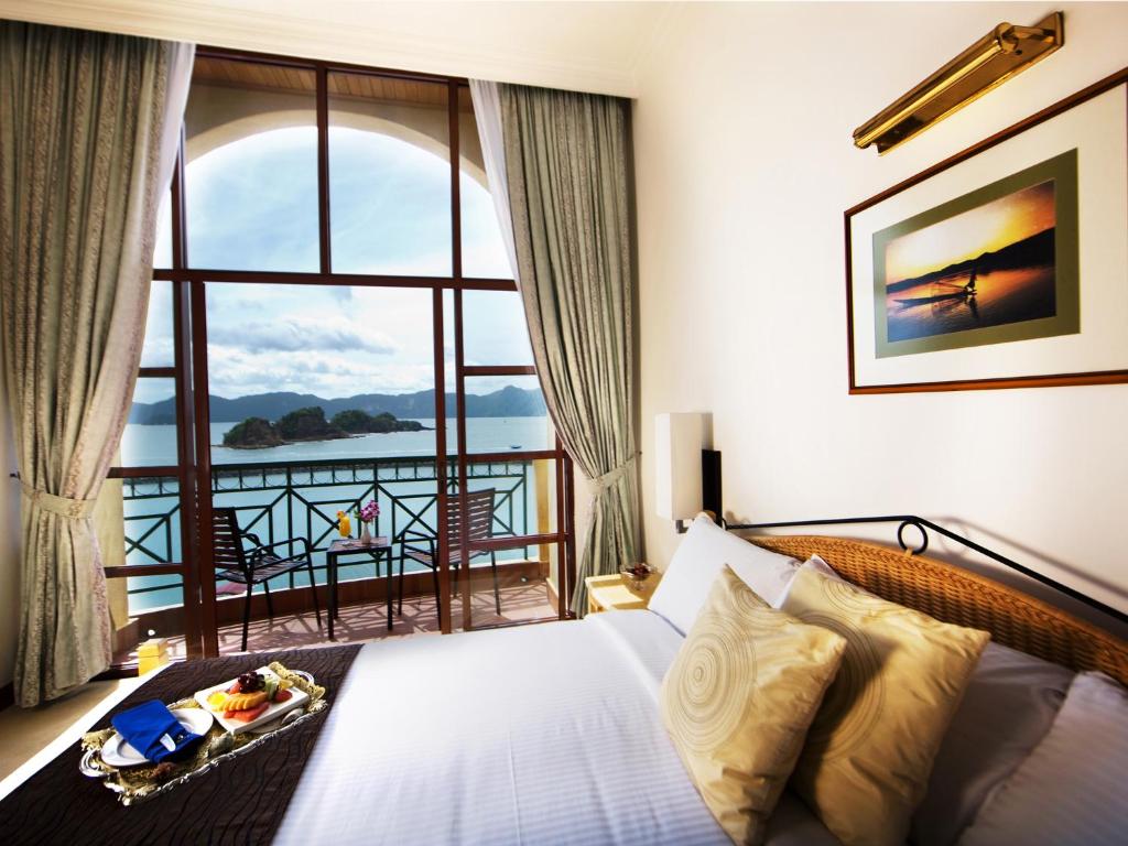 a hotel room with a view of the ocean at Resorts World Langkawi in Pantai Cenang