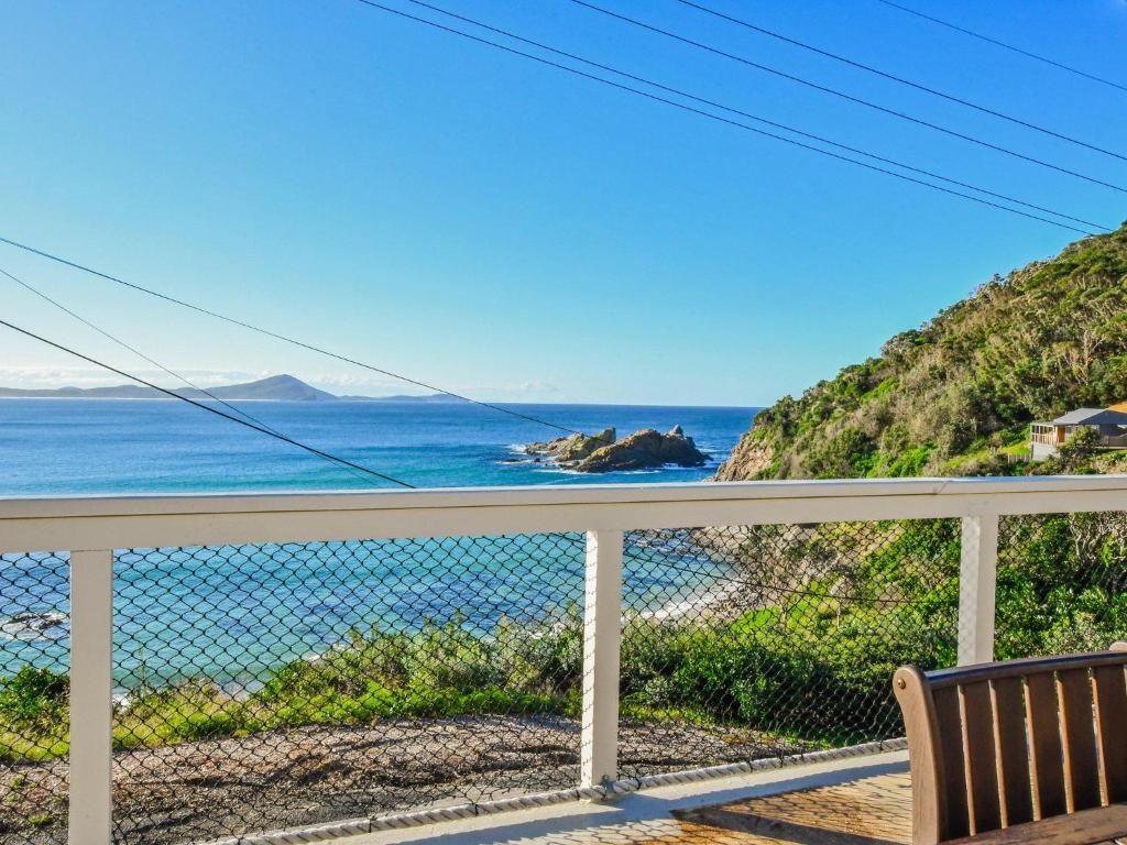 a view of the ocean from the balcony of a house at Briesta in Seal Rocks