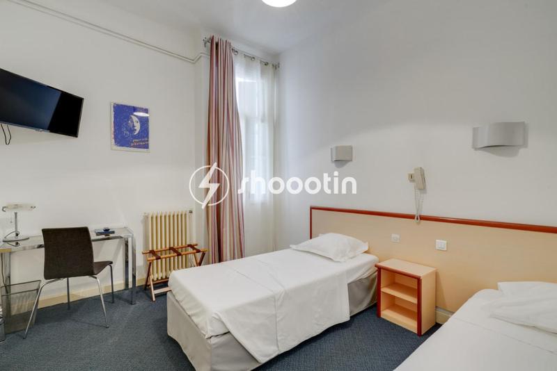 Postel nebo postele na pokoji v ubytování Hotel d'Angleterre