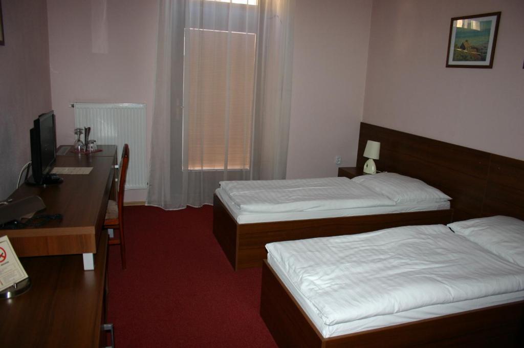 Postel nebo postele na pokoji v ubytování Hotel Jelen