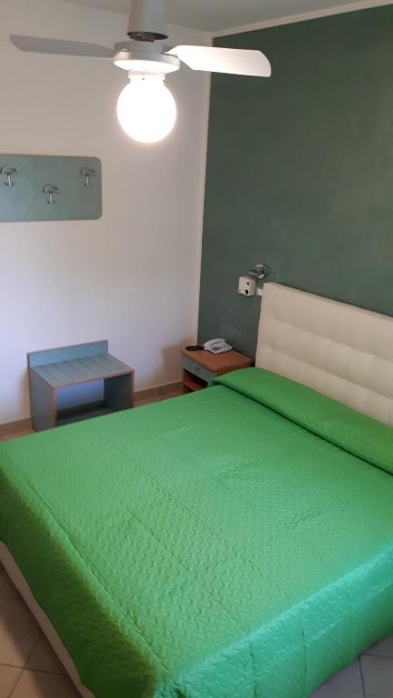 Postel nebo postele na pokoji v ubytování Hotel Ambra