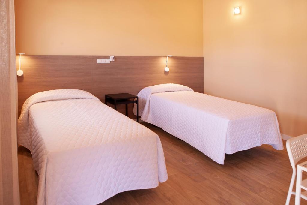 Postel nebo postele na pokoji v ubytování Hostal La Posada de Mari