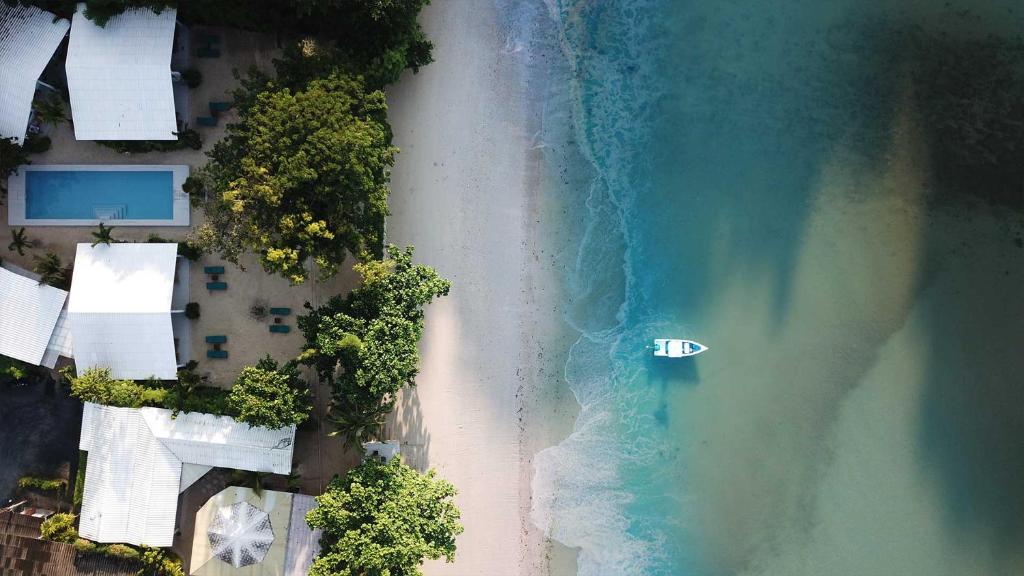 an overhead view of a beach and the ocean at The Mooring Resort in Panwa Beach