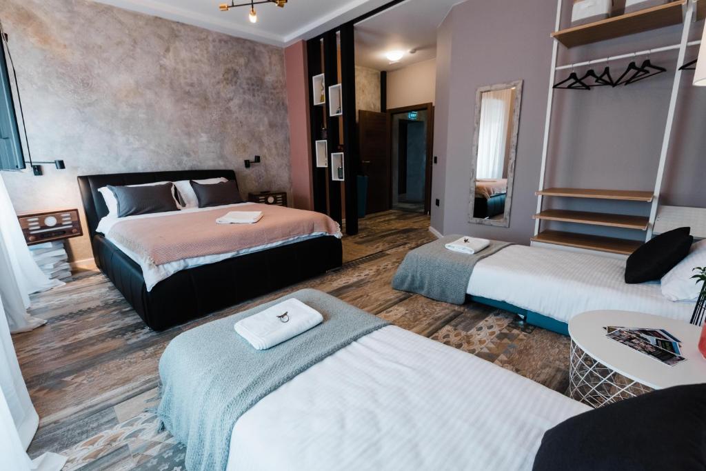 Postel nebo postele na pokoji v ubytování Square 19-Boutique rooms