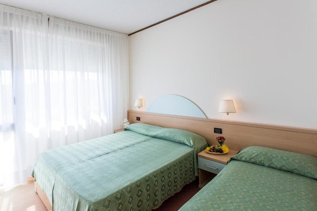 Postel nebo postele na pokoji v ubytování Hotel Europa