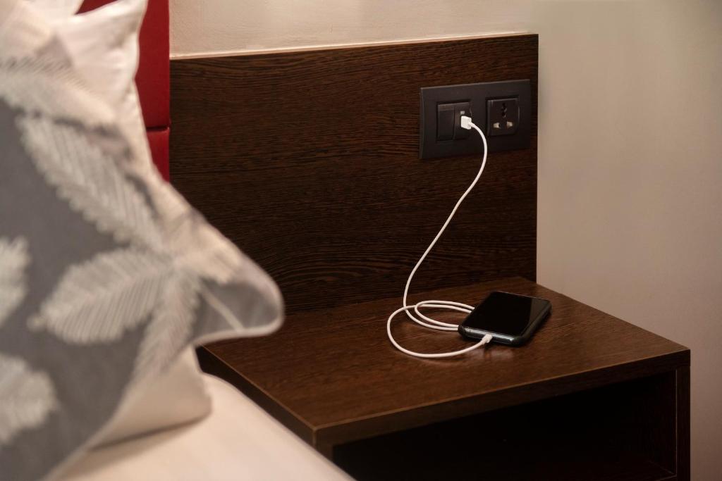 Postel nebo postele na pokoji v ubytování Hotel Palarine