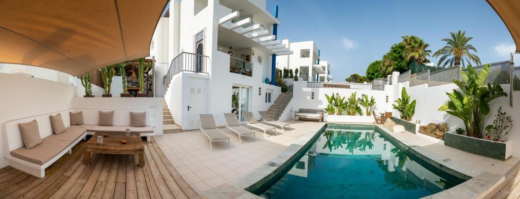 an image of a house with a swimming pool at Casa Aguila Ibiza in Cala Vadella