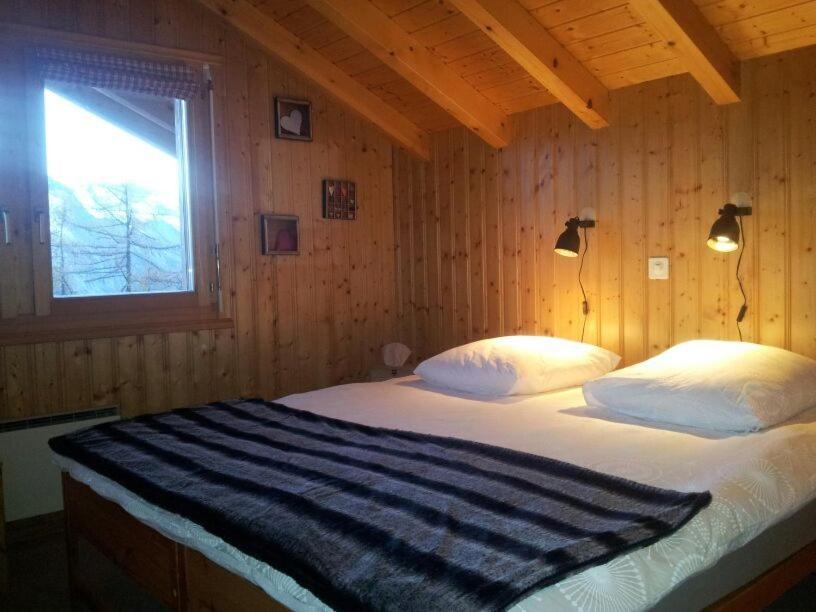 Postel nebo postele na pokoji v ubytování Chalet Mon Sousou