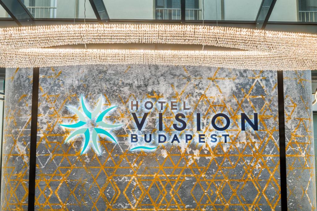 a sign for a hotel in a building at Hotel Vision Budapest by Continental Group in Budapest